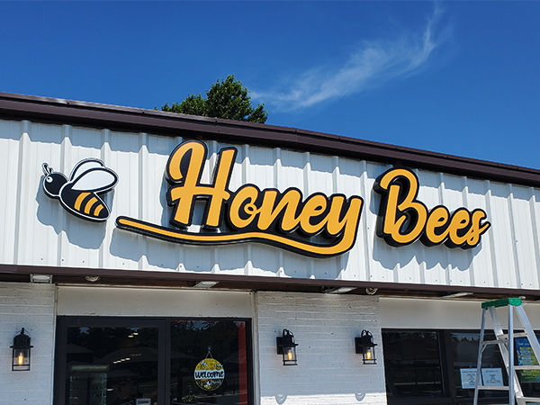 Custom shaped hanging blade sign